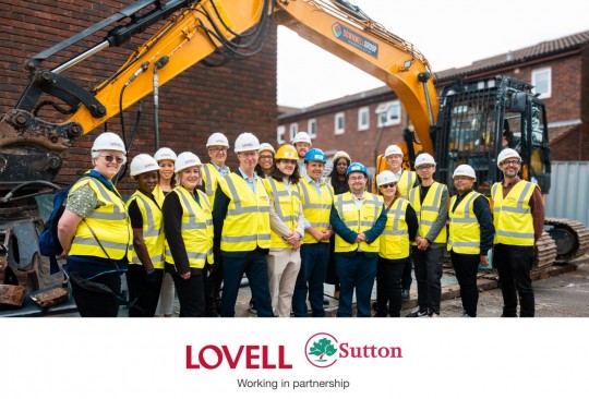 Attendees of the groundbreaking event pictured together at the site.